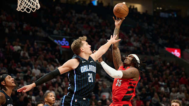 Oct 27, 2023; Portland, Oregon, USA; Portland Trail Blazers center Robert Williams III (35) shoots a basket during the first half against Orlando Magic center Moritz Wagner (21) at Moda Center.